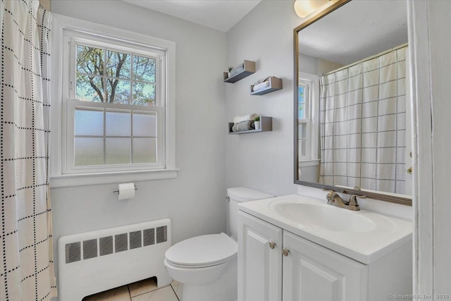 bathroom with toilet, a shower with curtain, radiator heating unit, and vanity