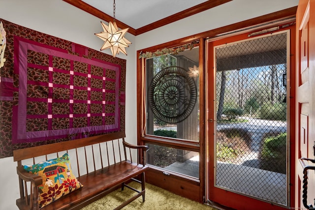interior space with crown molding and carpet