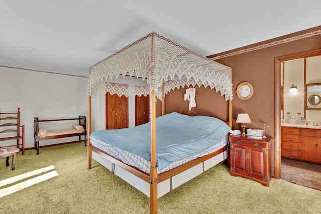 bedroom with carpet and ensuite bath