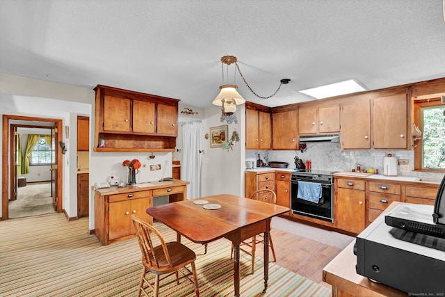 kitchen featuring open shelves, light countertops, under cabinet range hood, black electric range, and backsplash