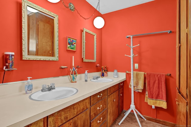 full bathroom featuring double vanity and a sink