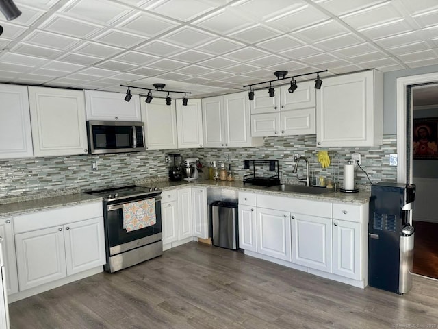 310 Sentinel Hill Rd, Derby, CT 06418 - kitchen with white cabinets, stainless steel appliances, decorative backsplash, and a sink