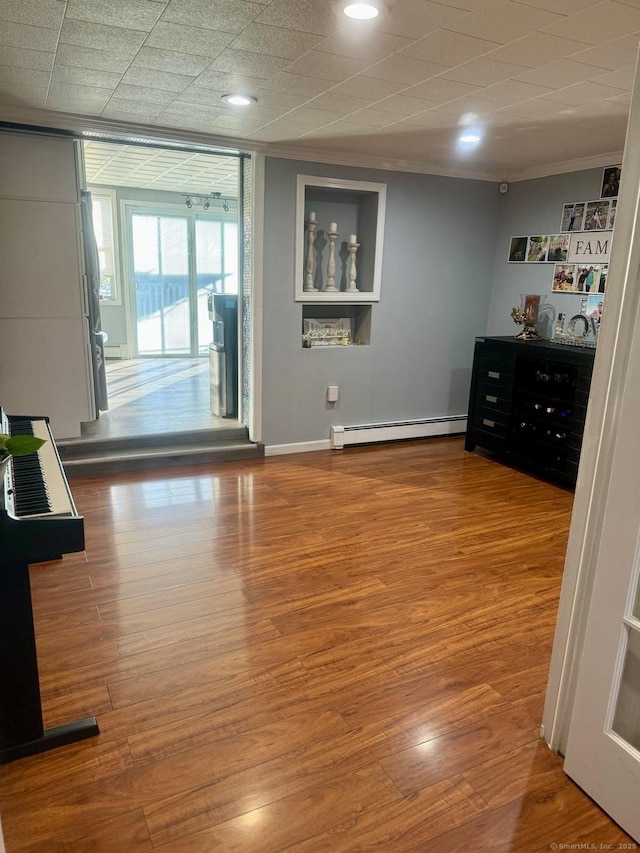310 Sentinel Hill Rd, Derby, CT 06418 - interior space with baseboards, a baseboard heating unit, ornamental molding, and wood finished floors