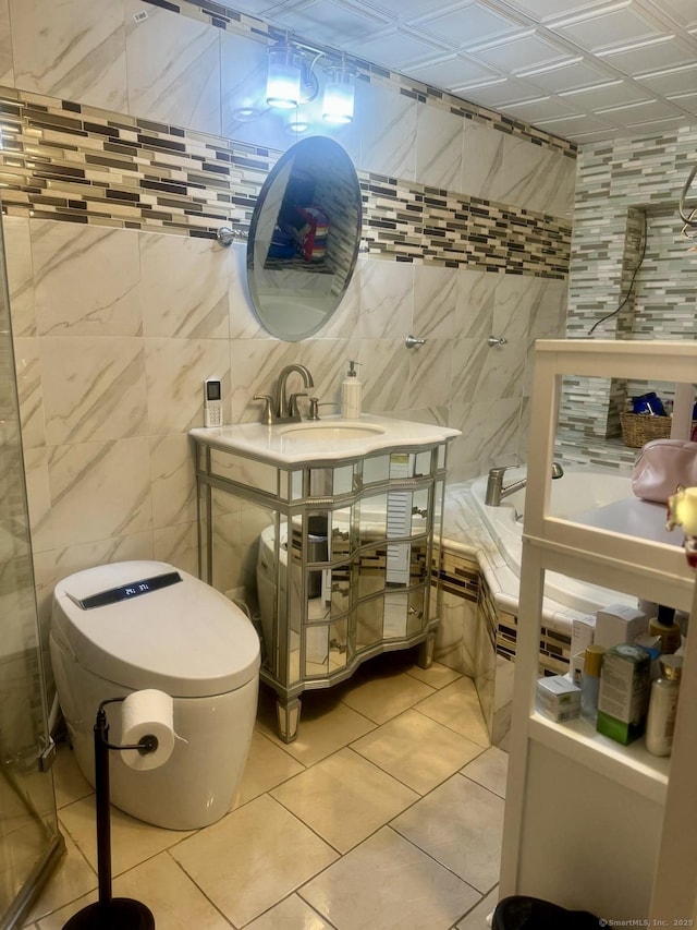 310 Sentinel Hill Rd, Derby, CT 06418 - full bathroom with tile patterned flooring, tile walls, a sink, and a tub to relax in