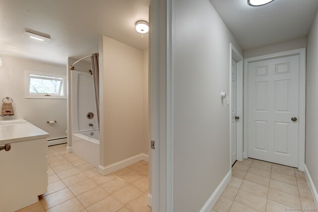 bathroom featuring shower / tub combination, vanity, tile patterned floors, baseboards, and a baseboard heating unit