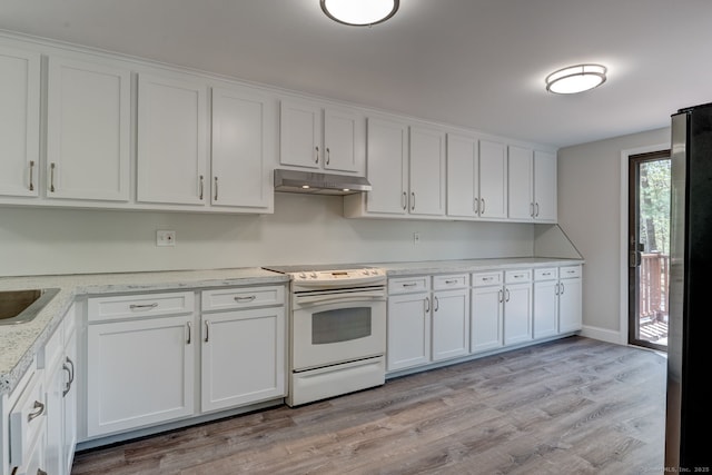 kitchen with white cabinets, electric stove, freestanding refrigerator, light wood-type flooring, and under cabinet range hood