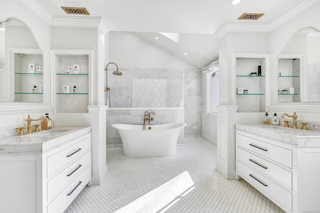 full bath featuring two vanities, walk in shower, ornamental molding, and a sink