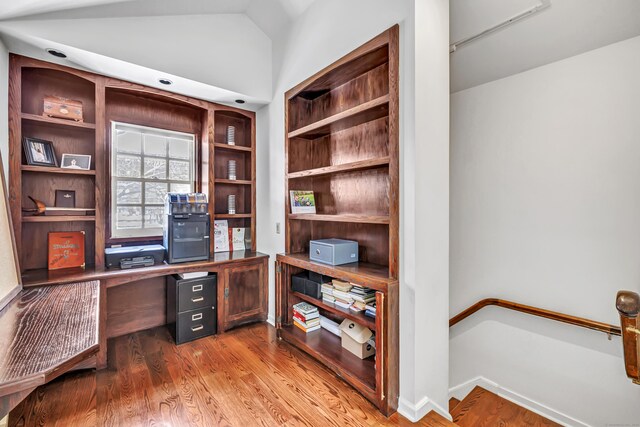 office area with wood finished floors and lofted ceiling