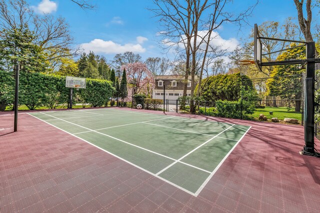 view of sport court featuring fence and community basketball court
