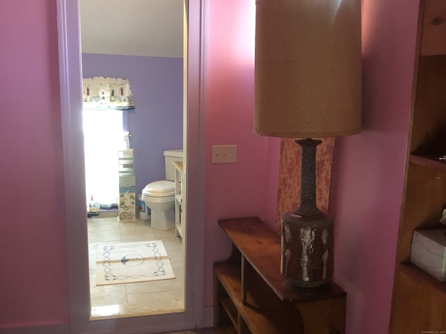 bathroom featuring tile patterned floors and toilet