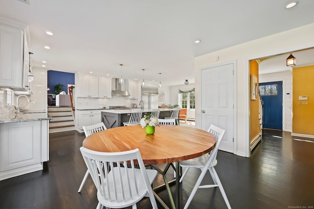 dining space featuring recessed lighting, dark wood finished floors, and a healthy amount of sunlight