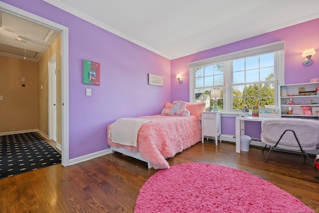 bedroom featuring crown molding, baseboards, attic access, and wood finished floors