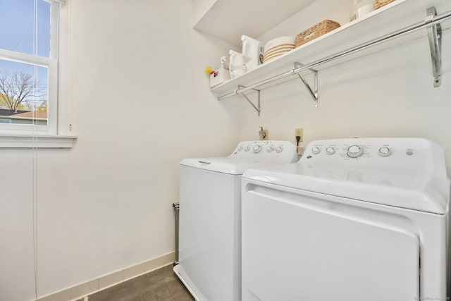 laundry room featuring laundry area, washer and clothes dryer, and baseboards