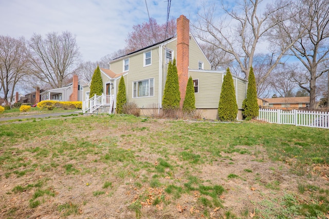 50 Fox Hill Rd, Stratford, CT 06614 - view of front of property with fence, a chimney, and a front yard