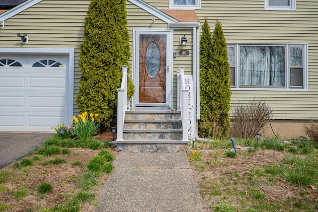 50 Fox Hill Rd, Stratford, CT 06614 - view of exterior entry with an attached garage