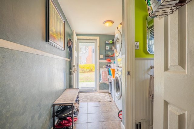 50 Fox Hill Rd, Stratford, CT 06614 - laundry room with a wainscoted wall, laundry area, tile patterned floors, and stacked washer / dryer