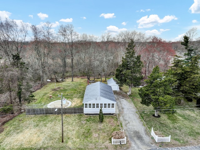 drone / aerial view with a wooded view