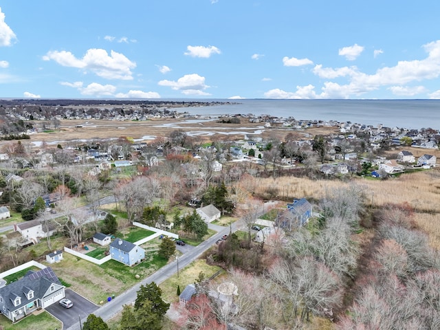 drone / aerial view with a residential view and a water view
