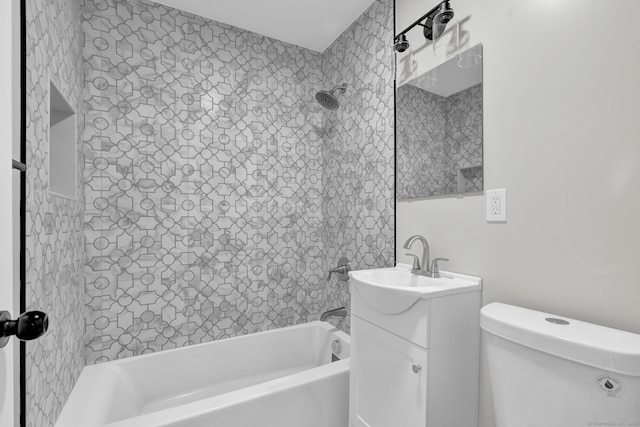 bathroom with toilet, shower / bath combination, and vanity