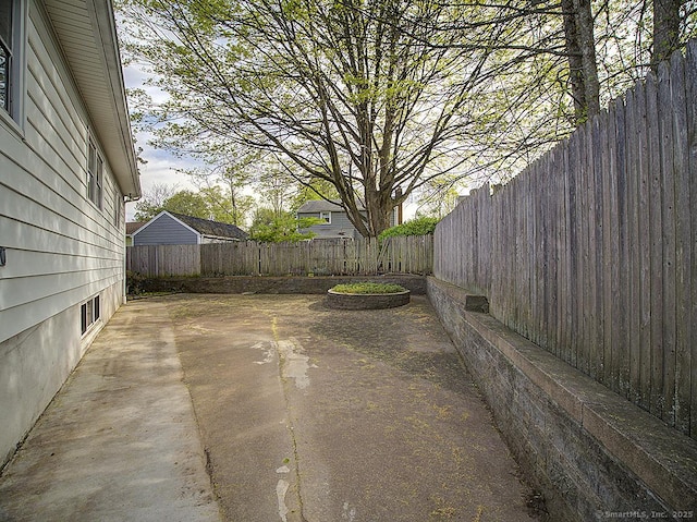 view of yard featuring a fenced backyard and a patio area
