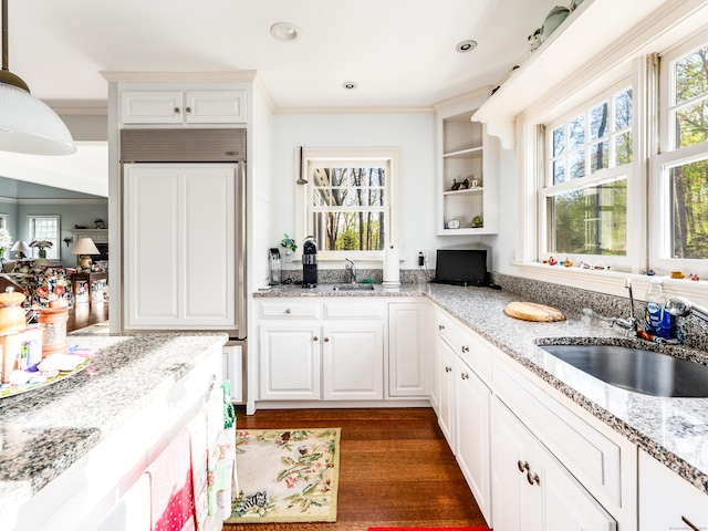 5 Clarks Ln, Old Lyme, CT 06371 - kitchen with a sink, paneled refrigerator, crown molding, white cabinets, and dark wood-style flooring
