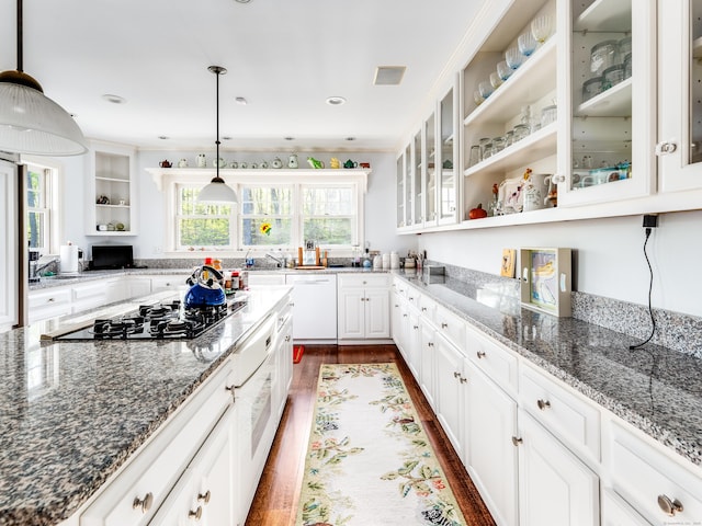 5 Clarks Ln, Old Lyme, CT 06371 - kitchen with open shelves, black gas cooktop, white cabinets, white dishwasher, and dark stone counters