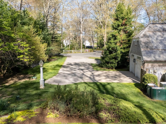 5 Clarks Ln, Old Lyme, CT 06371 - view of yard featuring a garage and view of scattered trees