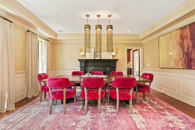 2 Grouse Path, Westport, CT 06880 - dining area with a fireplace, a decorative wall, ornamental molding, wood finished floors, and a wainscoted wall