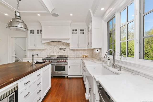 2 Grouse Path, Westport, CT 06880 - kitchen featuring appliances with stainless steel finishes, a sink, backsplash, white cabinetry, and glass insert cabinets