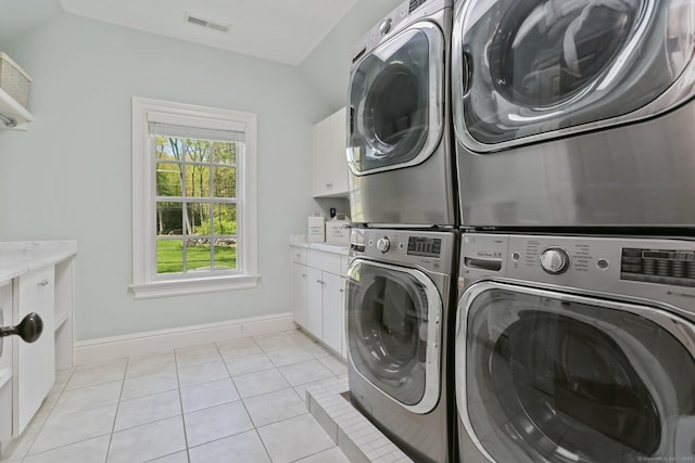 2 Grouse Path, Westport, CT 06880 - washroom with cabinet space, separate washer and dryer, stacked washer and clothes dryer, and light tile patterned floors