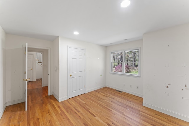 unfurnished bedroom with recessed lighting, baseboards, visible vents, and light wood finished floors