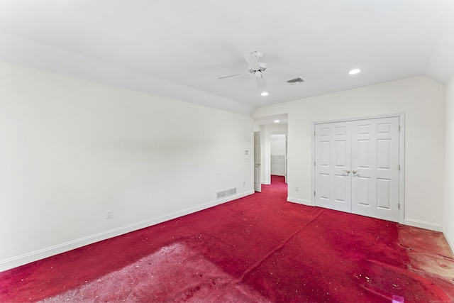 unfurnished bedroom featuring recessed lighting, baseboards, visible vents, and vaulted ceiling