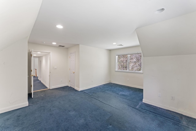 basement featuring baseboards, carpet flooring, and recessed lighting