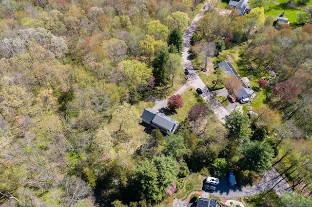 birds eye view of property with a forest view