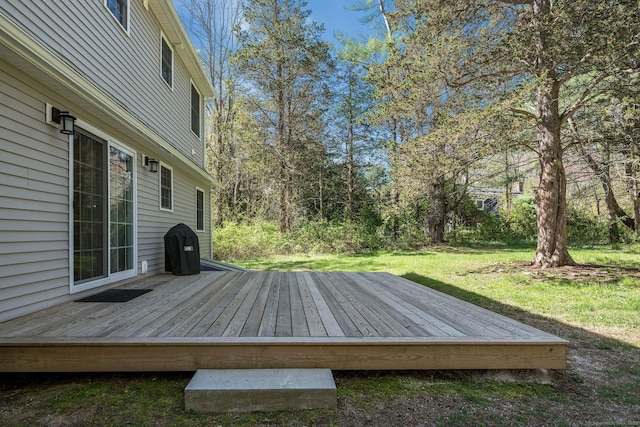 deck featuring a yard
