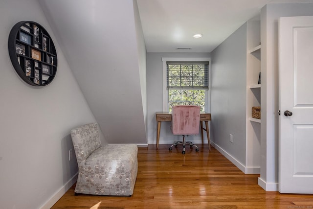 living area with baseboards, recessed lighting, wood finished floors, and visible vents