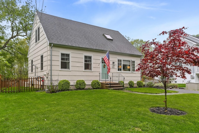 cape cod-style house with roof with shingles