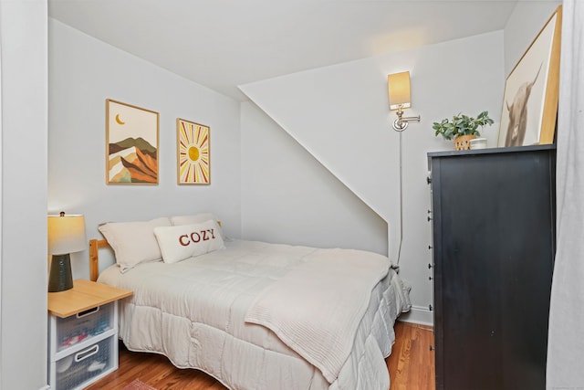 bedroom featuring wood finished floors