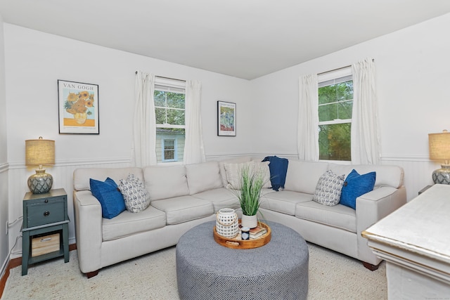 living area featuring wainscoting