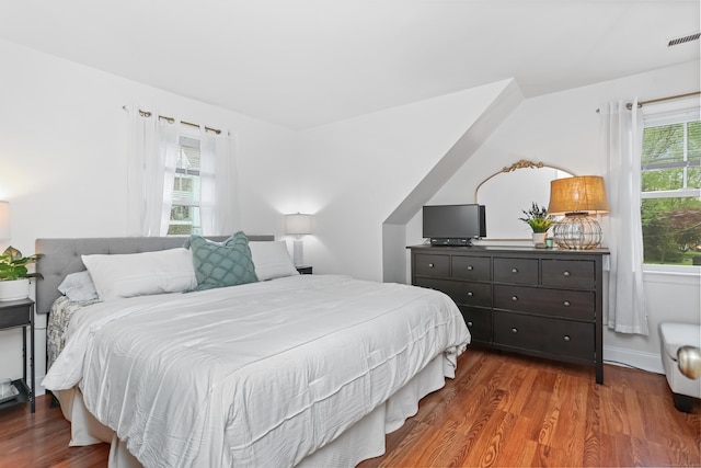 bedroom featuring wood finished floors