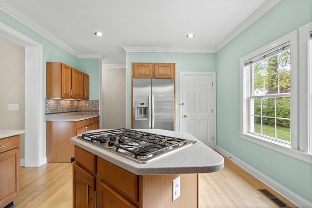kitchen featuring a wealth of natural light, light wood-style floors, visible vents, and appliances with stainless steel finishes