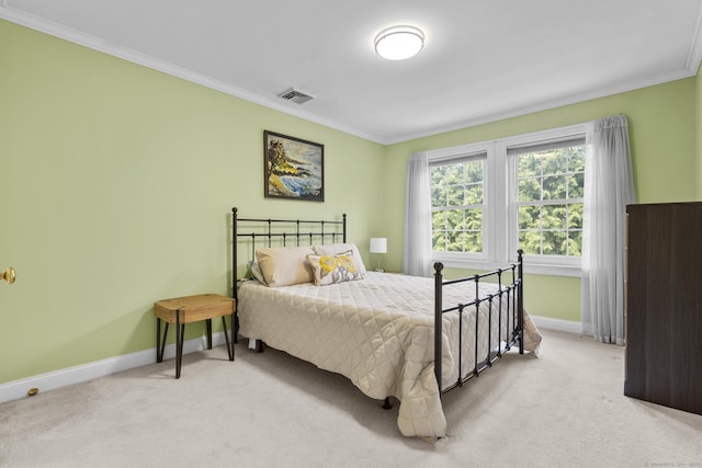 bedroom featuring baseboards, light carpet, and crown molding