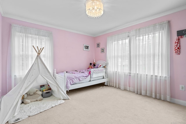 bedroom with ornamental molding, carpet, and a notable chandelier