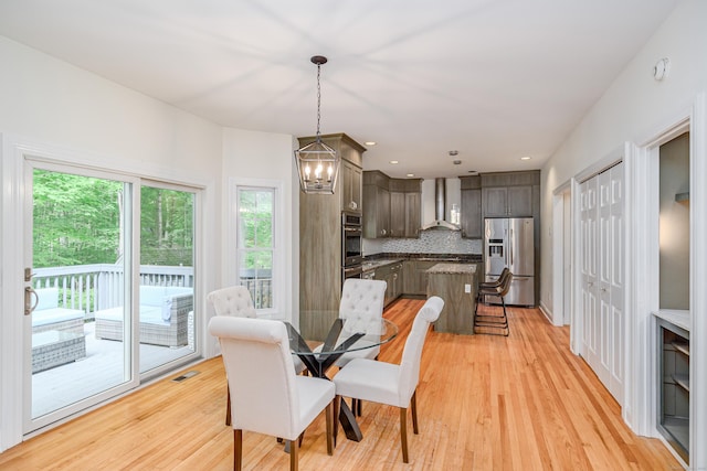 127 Hanover Rd, Newtown, CT 06470 - dining room with a chandelier, light wood-style flooring, and recessed lighting