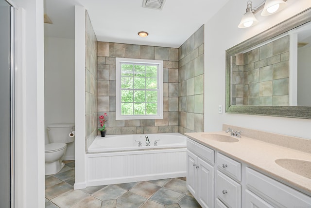 127 Hanover Rd, Newtown, CT 06470 - bathroom with a garden tub, toilet, and double vanity