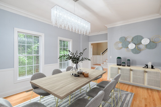 127 Hanover Rd, Newtown, CT 06470 - dining area featuring a chandelier, stairs, healthy amount of natural light, ornamental molding, and light wood-style floors