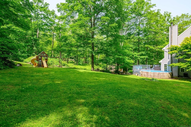 127 Hanover Rd, Newtown, CT 06470 - view of grassy yard with an outdoor pool and a playground