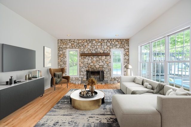 127 Hanover Rd, Newtown, CT 06470 - living area with light wood-style flooring, a stone fireplace, and recessed lighting