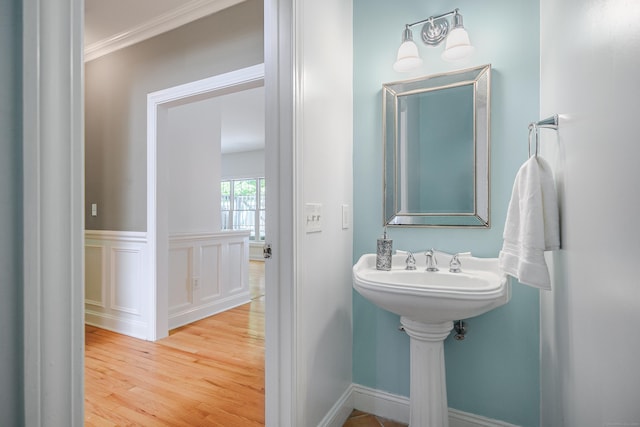 127 Hanover Rd, Newtown, CT 06470 - bathroom with wood finished floors and crown molding