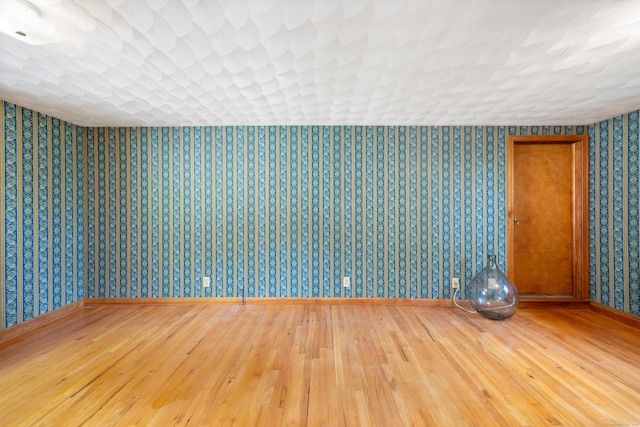 161 Center Hill Rd, Barkhamsted, CT 06063 - unfurnished room with wallpapered walls, hardwood / wood-style floors, and baseboards